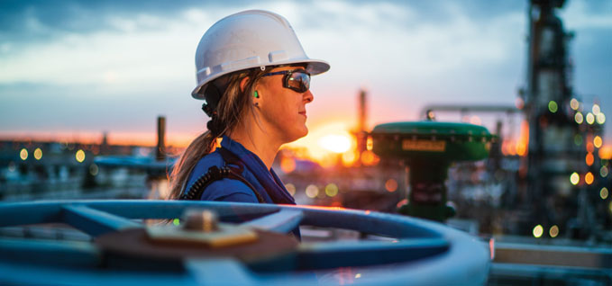 Woman wearing a hard hat and safety glasses